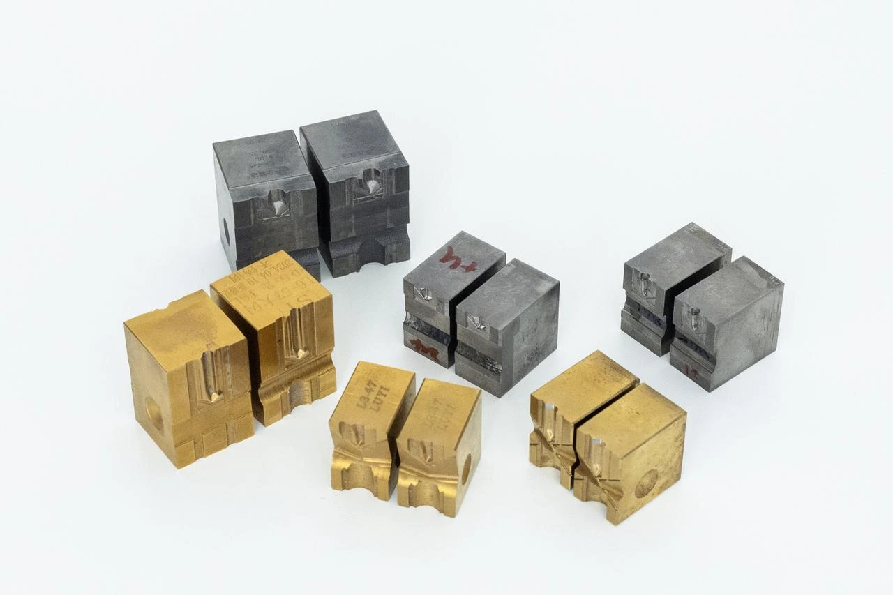 Drill-point dies with different cavity shapes